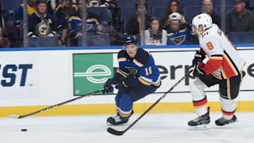 ST. LOUIS, MO - OCTOBER 11: Robert Thomas #18 of the St. Louis Blues skates against Juuso Valimaki #8 of the Calgary Flames at Enterprise Center on October 11, 2018 in St. Louis, Missouri. (Photo by Joe Puetz/NHLI via Getty Images)