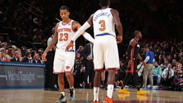 NEW YORK, NY - APRIL 6: Trey Burke #23 of the New York Knicks and Tim Hardaway Jr. #3 of the New York Knicks high-five during the game against the Miami Heat on April 6, 2018 at Madison Square Garden in New York City, New York. NOTE TO USER: User expressly acknowledges and agrees that, by downloading and or using this photograph, User is consenting to the terms and conditions of the Getty Images License Agreement. Mandatory Copyright Notice: Copyright 2018 NBAE (Photo by Nathaniel S. Butler/NBAE via Getty Images)