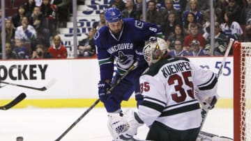 VANCOUVER, BC - FEBRUARY 28: Goaltender Darcy Kuemper #35 of the Minnesota Wild makes a save against Zack Kassian #9 of the Vancouver Canucks during the second period of their NHL game at Rogers Arena on February 28, 2014 in Vancouver, British Columbia, Canada. (Photo by Ben Nelms/Getty Images)