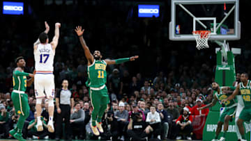 BOSTON, MASSACHUSETTS - DECEMBER 25: JJ Redick #17 of the Philadelphia 76ers shoots over Kyrie Irving #11 of the Boston Celtics during the fourth quarter of the game at TD Garden on December 25, 2018 in Boston, Massachusetts. NOTE TO USER: User expressly acknowledges and agrees that, by downloading and or using this photograph, User is consenting to the terms and conditions of the Getty Images License Agreement. (Photo by Omar Rawlings/Getty Images)
