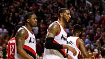 Apr 27, 2014; Portland, OR, USA; Portland Trail Blazers forward LaMarcus Aldridge (12) smiles during overtime in game four of the first round of the 2014 NBA Playoffs against the Houston Rockets at the Moda Center. Mandatory Credit: Craig Mitchelldyer-USA TODAY Sports