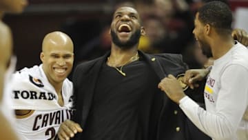 Apr 13, 2016; Cleveland, OH, USA; Cleveland Cavaliers forward Richard Jefferson, left, LeBron James, center, and Tristan Thompson celebrate near the bench in the fourth quarter against the Detroit Pistons at Quicken Loans Arena. Mandatory Credit: David Richard-USA TODAY Sports