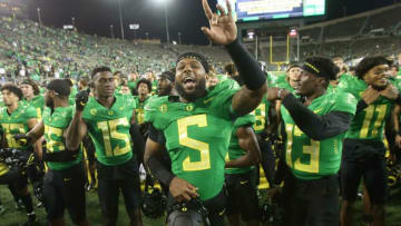 Oregon's Kayvon Thibodeaux celebrates with teammates after the win over Arizona in their first Pac-12 game of the season.Eug 0922521 Uo Az 16