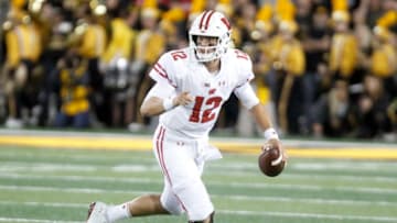 IOWA CITY, IOWA- SEPTEMBER 22: Quarterback Alex Hornibrook #12 of the Wisconsin Badgers scrambles on a keeper in the first half against the Iowa Hawkeyes on September 22, 2018 at Kinnick Stadium, in Iowa City, Iowa. (Photo by Matthew Holst/Getty Images)