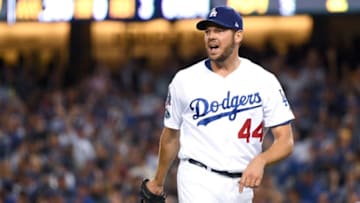 LOS ANGELES, CA - OCTOBER 16: Rich Hill #44 of the Los Angeles Dodgers reacts after a play by Justin Turner #10 (not pictured) to end the third inning against the Milwaukee Brewers in Game Four of the National League Championship Series at Dodger Stadium on October 16, 2018 in Los Angeles, California. (Photo by Harry How/Getty Images)
