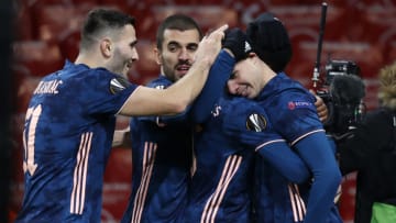 Arsenal's English midfielder Emile Smith Rowe (R) celebrates with teammates after scoring their fourth goal during the UEFA Europa League 1st Round Group B football match between Arsenal and Rapid Vienna at the Emirates Stadium in London on December 3, 2020. (Photo by Adrian DENNIS / AFP) (Photo by ADRIAN DENNIS/AFP via Getty Images)