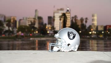 Feb 16, 2016; Los Angeles, CA, USA; General view of Oakland Raiders helmet at McArthur Park with the downtown Los Angeles skyline as a backdrop. NFL owners voted 30-2 to allow owner Rams Stan Kroenke (not pictured) to move the St. Louis Rams to Los Angeles for the 2016 season with an option also award to Raiders owner Mark Davis (not pictured). Mandatory Credit: Kirby Lee-USA TODAY Sports