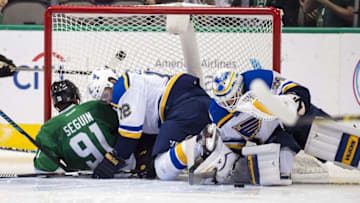 Dec 20, 2016; Dallas, TX, USA; St. Louis Blues center Jori Lehtera (12) takes down Dallas Stars center Tyler Seguin (91) during the third period at the American Airlines Center. The Blues defeat the Stars 3-2 in overtime. Mandatory Credit: Jerome Miron-USA TODAY Sports