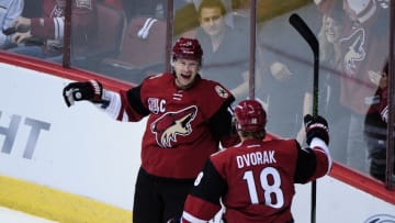 Oct 15, 2016; Glendale, AZ, USA; Arizona Coyotes right wing Shane Doan (19) celebrates with left wing Christian Dvorak (18) after scoring a goal in the first period against Philadelphia Flyers at Gila River Arena. Mandatory Credit: Matt Kartozian-USA TODAY Sports