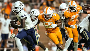 Sep 17, 2022; Knoxville, Tennessee, USA; Tennessee Volunteers defensive lineman Jordan Phillips (50) chases Akron Zips quarterback DJ Irons (0) during the second half at Neyland Stadium. Mandatory Credit: Bryan Lynn-USA TODAY Sports