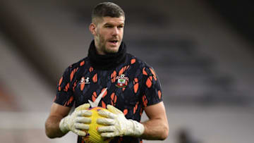 Southampton's English goalkeeper Fraser Forster warms up ahead of the English Premier League football match between Wolverhampton Wanderers and Southampton at the Molineux stadium in Wolverhampton, central England on November 23, 2020. (Photo by Oli SCARFF / POOL / AFP) / RESTRICTED TO EDITORIAL USE. No use with unauthorized audio, video, data, fixture lists, club/league logos or 'live' services. Online in-match use limited to 120 images. An additional 40 images may be used in extra time. No video emulation. Social media in-match use limited to 120 images. An additional 40 images may be used in extra time. No use in betting publications, games or single club/league/player publications. / (Photo by OLI SCARFF/POOL/AFP via Getty Images)
