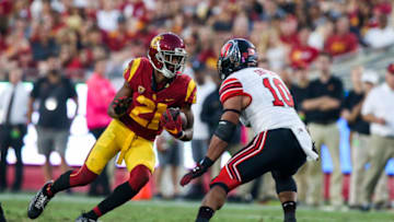 LOS ANGELES, CA - OCTOBER 14: wide receiver Tyler Vaughns (21) of the USC Trojans catches the ball then tries to run pass linebacker Sunia Tauteoli (10) of the Utah Utes in a game between the Utah Utes vs USC Trojans on October 14, 2017 at Los Angeles Memorial Coliseum in Los Angeles, CA. (Photo by Jordon Kelly/Icon Sportswire via Getty Images)