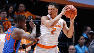 KNOXVILLE, TN - FEBRUARY 21: Grant Williams #2 of the Tennessee Volunteers looks to the basket against Deaundrae Ballard #24 of the Florida Gators in the second half of a game at Thompson-Boling Arena on February 21, 2018 in Knoxville, Tennessee. Tennessee won 62-57. (Photo by Joe Robbins/Getty Images)