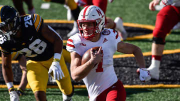 Nebraska Cornhuskers quarterback Luke McCaffrey (7) runs the ball as Iowa Hawkeyes defensive back Kaevon Merriweather (26) gives chase during the first quarter at Kinnick Stadium. Mandatory Credit: Jeffrey Becker-USA TODAY Sports