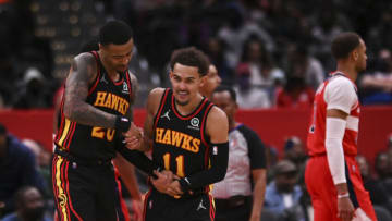 Mar 4, 2022; Washington, District of Columbia, USA; Atlanta Hawks guard Trae Young (11) celebrates with forward John Collins (20) after making a basket during the second half against the Washington Wizards at Capital One Arena. Mandatory Credit: Tommy Gilligan-USA TODAY Sports