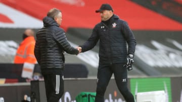 SOUTHAMPTON, ENGLAND - DECEMBER 13: Chris Wilder, Manager of Sheffield United and Ralph Hasenhuttl, Manager of Southampton interact following the Premier League match between Southampton and Sheffield United at St Mary's Stadium on December 13, 2020 in Southampton, England. A limited number of spectators (2000) are welcomed back to stadiums to watch elite football across England. This was following easing of restrictions on spectators in tiers one and two areas only. (Photo by Adam Davy - Pool/Getty Images)