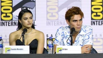 SAN DIEGO, CALIFORNIA - JULY 21: Camila Mendes and KJ Apa speak at the "Riverdale" Special Video Presentation and Q&A during 2019 Comic-Con International at San Diego Convention Center on July 21, 2019 in San Diego, California. (Photo by Kevin Winter/Getty Images)