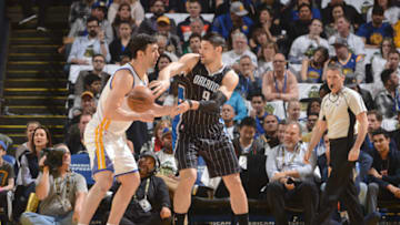 OAKLAND, CA - MARCH 16: Nikola Vucevic #9 of the Orlando Magic passes the ball during a game against the Golden State Warriors on March 16, 2017 at ORACLE Arena in Oakland, California. NOTE TO USER: User expressly acknowledges and agrees that, by downloading and/or using this photograph, user is consenting to the terms and conditions of Getty Images License Agreement. Mandatory Copyright Notice: Copyright 2017 NBAE (Photo by Noah Graham/NBAE via Getty Images)