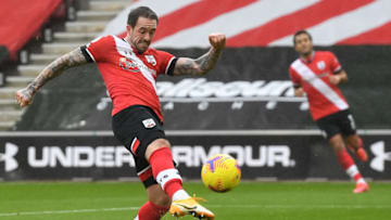Southampton's English striker Danny Ings shoots to score the opening goal of the English Premier League football match between Southampton and Wolverhampton Wanderers at St Mary's Stadium in Southampton, southern England on February 14, 2021. (Photo by Andy Rain / POOL / AFP) / RESTRICTED TO EDITORIAL USE. No use with unauthorized audio, video, data, fixture lists, club/league logos or 'live' services. Online in-match use limited to 120 images. An additional 40 images may be used in extra time. No video emulation. Social media in-match use limited to 120 images. An additional 40 images may be used in extra time. No use in betting publications, games or single club/league/player publications. / (Photo by ANDY RAIN/POOL/AFP via Getty Images)