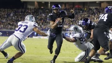 Nov 8, 2014; Fort Worth, TX, USA; TCU Horned Frogs quarterback Trevone Boykin (2) runs for a touchdown in the first quarter against Kansas State Wildcats defensive back Morgan Burns (33) and defensive lineman Travis Britz (95) at Amon G. Carter Stadium. Mandatory Credit: Tim Heitman-USA TODAY Sports