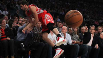 Nov 14, 2013; New York, NY, USA; Houston Rockets small forward Omri Casspi (18) dives into the stands for a loose ball against the New York Knicks during the fourth quarter of a game at Madison Square Garden. The Rockets beat the Knicks 109-106. Mandatory Credit: Brad Penner-USA TODAY Sports