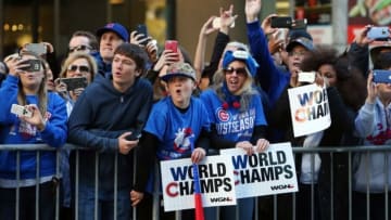 Nov 4, 2016; Chicago, IL, USA; Chicago Cubs fans cheer and take photos during the World Series victory parade on Michigan Avenue. Mandatory Credit: Jerry Lai-USA TODAY Sports