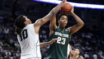 Jan 10, 2016; University Park, PA, USA; Michigan State Spartans forward Deyonta Davis (23) controls the ball as Penn State Nittany Lions forward Brandon Taylor (10) defends during the second half at Bryce Jordan Center. Michigan State defeated Penn State 92-65. Mandatory Credit: Matthew O
