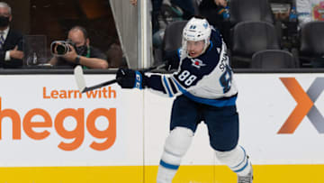 Oct 30, 2021; San Jose, California, USA; Winnipeg Jets defenseman Nate Schmidt (88) shoots the puck during the third period against the San Jose Sharks at SAP Center at San Jose. Mandatory Credit: Stan Szeto-USA TODAY Sports