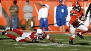 Nov 1, 2015; Cleveland, OH, USA; Cleveland Browns running back Isaiah Crowell (34) carries the ball past Arizona Cardinals outside linebacker LaMarr Woodley (56) at FirstEnergy Stadium. The Cardinals won 34-20. Mandatory Credit: Scott R. Galvin-USA TODAY Sports