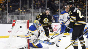 Dec 7, 2023; Boston, Massachusetts, USA; Buffalo Sabres goaltender Devon Levi (27) makes a save in front of Boston Bruins left wing James van Riemsdyk (21) during the third period at TD Garden. Mandatory Credit: Bob DeChiara-USA TODAY Sports