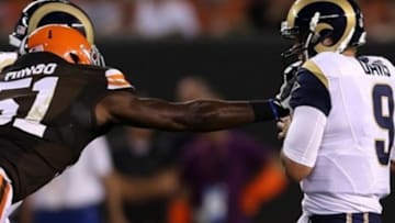 Aug 8, 2013; Cleveland, OH, USA; Cleveland Browns defensive end Barkevious Mingo (51) tries to tackle St. Louis Rams quarterback Austin Davis (9) during the second quarter at FirstEnergy Field. Mandatory Credit: Ron Schwane-USA TODAY Sports