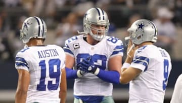 Dec 2, 2012; Arlington, TX, USA; Dallas Cowboys quarterback Tony Romo (9) talks with tight end Jason Witten (82) and wide receiver Miles Austin (19) during the game against the Philadelphia Eagles at Cowboys Stadium. The Cowboys beat the Eagles 38-33. Mandatory Credit: Tim Heitman-USA TODAY Sports
