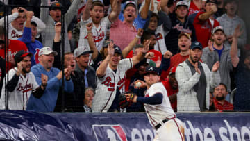 ATLANTA, GEORGIA - OCTOBER 12: Austin Riley #27 of the Atlanta Braves throws the ball after making a catch against the Philadelphia Phillies during the eighth inning in game two of the National League Division Series at Truist Park on October 12, 2022 in Atlanta, Georgia. (Photo by Kevin C. Cox/Getty Images)