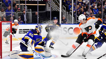 Mar 24, 2022; St. Louis, Missouri, USA; St. Louis Blues goaltender Jordan Binnington (50) defends the net against Philadelphia Flyers right wing Hayden Hodgson (42) during the first period at Enterprise Center. Mandatory Credit: Jeff Curry-USA TODAY Sports