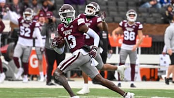 Nov 19, 2022; Starkville, Mississippi, USA; Mississippi State Bulldogs cornerback Emmanuel Forbes (13) returns an interception for a touchdown against the East Tennessee State Buccaneers during the second quarter at Davis Wade Stadium at Scott Field. Mandatory Credit: Matt Bush-USA TODAY Sports