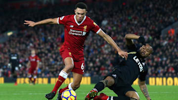 LIVERPOOL, ENGLAND - DECEMBER 26: Trent Alex Arnold of Liverpool is tackled by Jordan Ayew of Swansea City during the Premier League match between Liverpool and Swansea City at Anfield on December 26, 2017 in Liverpool, England. (Photo by Jan Kruger/Getty Images)