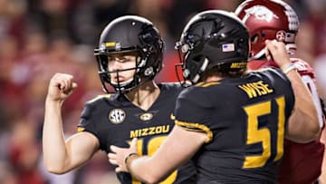 FAYETTEVILLE, AR - NOVEMBER 24: Tucker McCann #19 of the Missouri Tigers celebrates after kicking the winning field goal during a game against the Arkansas Razorbacks at Razorback Stadium on November 24, 2017 in Fayetteville, Arkansas. The Tigers defeated the Razorbacks 48-45. (Photo by Wesley Hitt/Getty Images)