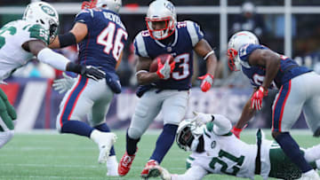 FOXBORO, MA - DECEMBER 31: Dion Lewis #33 of the New England Patriots runs with the ball during the second half against the New York Jets at Gillette Stadium on December 31, 2017 in Foxboro, Massachusetts. (Photo by Maddie Meyer/Getty Images)