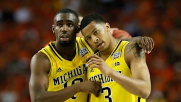ATLANTA, GA - APRIL 06: (L-R) Tim Hardaway Jr. #10 and Trey Burke #3 of the Michigan Wolverines react in the second half against the Syracuse Orange during the 2013 NCAA Men's Final Four Semifinal at the Georgia Dome on April 6, 2013 in Atlanta, Georgia. (Photo by Kevin C. Cox/Getty Images)