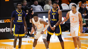 KNOXVILLE, TN - JANUARY 26: Wesley Harris #21 of the West Virginia Mountaineers, Admiral Schofield #5 of the Tennessee Volunteers, Derek Culver #1 of the West Virginia Mountaineers, and Grant Williams #2 of the Tennessee Volunteers work for position before a play during the second half of their game at Thompson-Boling Arena on January 26, 2019 in Knoxville, Tennessee. Tennessee won the game 83-66.(Photo by Donald Page/Getty Images)