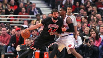 Mar 28, 2015; Chicago, IL, USA; Chicago Bulls forward Nikola Mirotic (44) backs down New York Knicks guard Ricky Ledo (11) during the second quarter at the United Center. Mandatory Credit: Dennis Wierzbicki-USA TODAY Sports