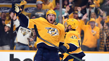 May 9, 2022; Nashville, Tennessee, USA; Nashville Predators center Yakov Trenin (13) celebrates with defenseman Alexandre Carrier (45) after scoring during the second period against the Colorado Avalanche in game four of the first round of the 2022 Stanley Cup Playoffs at Bridgestone Arena. Mandatory Credit: Christopher Hanewinckel-USA TODAY Sports