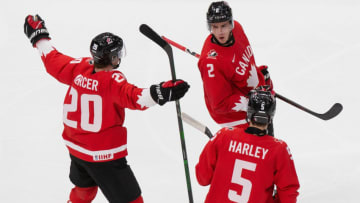 EDMONTON, AB - JANUARY 04: Dawson Mercer #20, Braden Schneider #2 and Thomas Harley #5 of Canada celebrate a goal against Russia during the 2021 IIHF World Junior Championship semifinals at Rogers Place on January 4, 2021 in Edmonton, Canada. (Photo by Codie McLachlan/Getty Images)