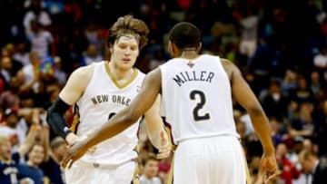 Apr 14, 2014; New Orleans, LA, USA; New Orleans Pelicans forward Luke Babbitt (8) reacts with forward Darius Miller (2) after a three point basket against the Oklahoma City Thunder during the fourth quarter of a game at Smoothie King Center. The Pelicans defeated the Thunder 101-89. Mandatory Credit: Derick E. Hingle-USA TODAY Sports
