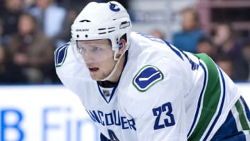EDMONTON, AB - OCTOBER 19: Alexander Edler #23 of the Vancouver Canucks concentrates on the face-off during a game against the Edmonton Oilers at Rexall Place on October 19, 2009 in Edmonton, Alberta, Canada. The Oilers beat the Canucks 2-1. (Photo by Andy Devlin/NHLI via Getty Images)