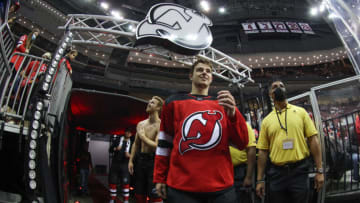 New Jersey Devils defenseman Colton White (2) and defenseman Dougie Hamilton (7) look at the ice during a delay to the start of the preseason game between the Devils and the New York Islanders due to a power outage at Prudential Center. Mandatory Credit: Ed Mulholland-USA TODAY Sports