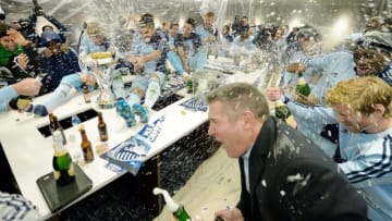 Sporting KC head coach Peter Vermes, right, joins the team in celebrating in the locker room after defeating Real Salt Lake in the MLS Cup Final at Sporting Park in Kansas City, Kan., Saturday, Dec. 7, 2013. Sporting won on penalty kicks. (John Sleezer/Kansas City Star/Tribune News Service via Getty Images)