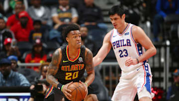 ATLANTA, GA - APRIL 10: John Collins #20 of the Atlanta Hawks moves to pass the ball during the game against Ersan Ilyasova #23 of the Philadelphia 76ers on April 10, 2018 at Philips Arena in Atlanta, Georgia. NOTE TO USER: User expressly acknowledges and agrees that, by downloading and/or using this Photograph, user is consenting to the terms and conditions of the Getty Images License Agreement. Mandatory Copyright Notice: Copyright 2018 NBAE (Photo by Kevin Liles/NBAE via Getty Images)