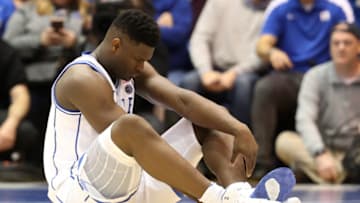 DURHAM, NORTH CAROLINA - FEBRUARY 20: Zion Williamson #1 of the Duke Blue Devils reacts after falling as his shoe breaks against Luke Maye #32 of the North Carolina Tar Heels during their game at Cameron Indoor Stadium on February 20, 2019 in Durham, North Carolina. (Photo by Streeter Lecka/Getty Images)