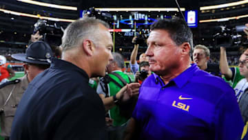 ARLINGTON, TX - SEPTEMBER 02: (R-L) Head coach Ed Orgeron of the LSU Tigers greets head coach Mark Richt of the Miami Hurricanes at midfield after the LSU Tigers beat the Miami Hurricanes 33-17 in The AdvoCare Classic at AT&T Stadium on September 2, 2018 in Arlington, Texas. (Photo by Tom Pennington/Getty Images)